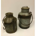 Two vintage style milk churns, one appro