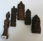 A collection of five ethnic carved woode