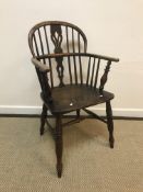 A 19th Century Nottinghamshire beech and elm stick back elbow chair, the pierced back splat with