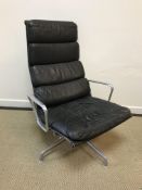 A Charles and Ray Eames for Herman Miller, Model EA216 swivel armchair, in dark brown leather with