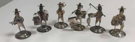 A collection of six Hong Kong Chinese sterling silver figures of fishermen and traders, the