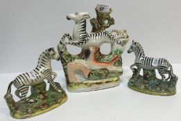 Two 19th Century Staffordshire pottery figures of Zebra, 11.5 cm long x 12 cm high and 12.2 cm