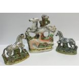 Two 19th Century Staffordshire pottery figures of Zebra, 11.5 cm long x 12 cm high and 12.2 cm