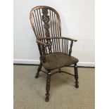 A 19th Century Nottinghamshire (poss Worksop) yew wood and elm stick back elbow chair with pierced