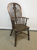 A 19th Century Nottinghamshire (poss Worksop) yew wood and elm stick back elbow chair with pierced