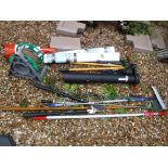 A collection of assorted garden tools to include loppers, hoe, fork and spade, etc, together with