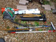 A collection of assorted garden tools to include loppers, hoe, fork and spade, etc, together with