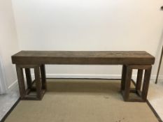 A Chinese teak altar or side table, the single plank top on two box section end pillar supports, 224