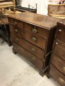 A 19th Century oak chest, the top with moulded edge over two short and three long graduated