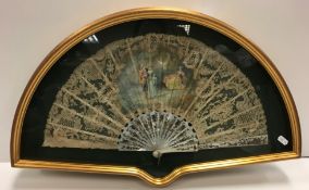 A late 19th Century J Donzel fan, the lacework leaf set with courting couple with chaperone and