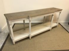 An OKA painted and oak top breakfront side table on turned fluted supports united by an undertier,