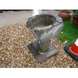 A composite stone bird bath / garden urn raised on square tapering base, approx 36 cm x 36 cm x 53