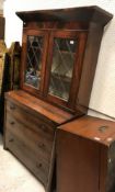 A 19th Century figured mahogany secretaire bookcase, the upper section with canted cornice over