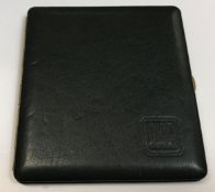 A Dunhill green leather cigarette case, 11.5 cm x 10 cm