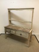 A Victorian pine dresser, the two tier plate rack over two drawers on square tapered legs, 136 cm