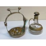 A mid 20th Century glass and plated mounted Vodka tantalus with onion shaped jug and lockable stand,