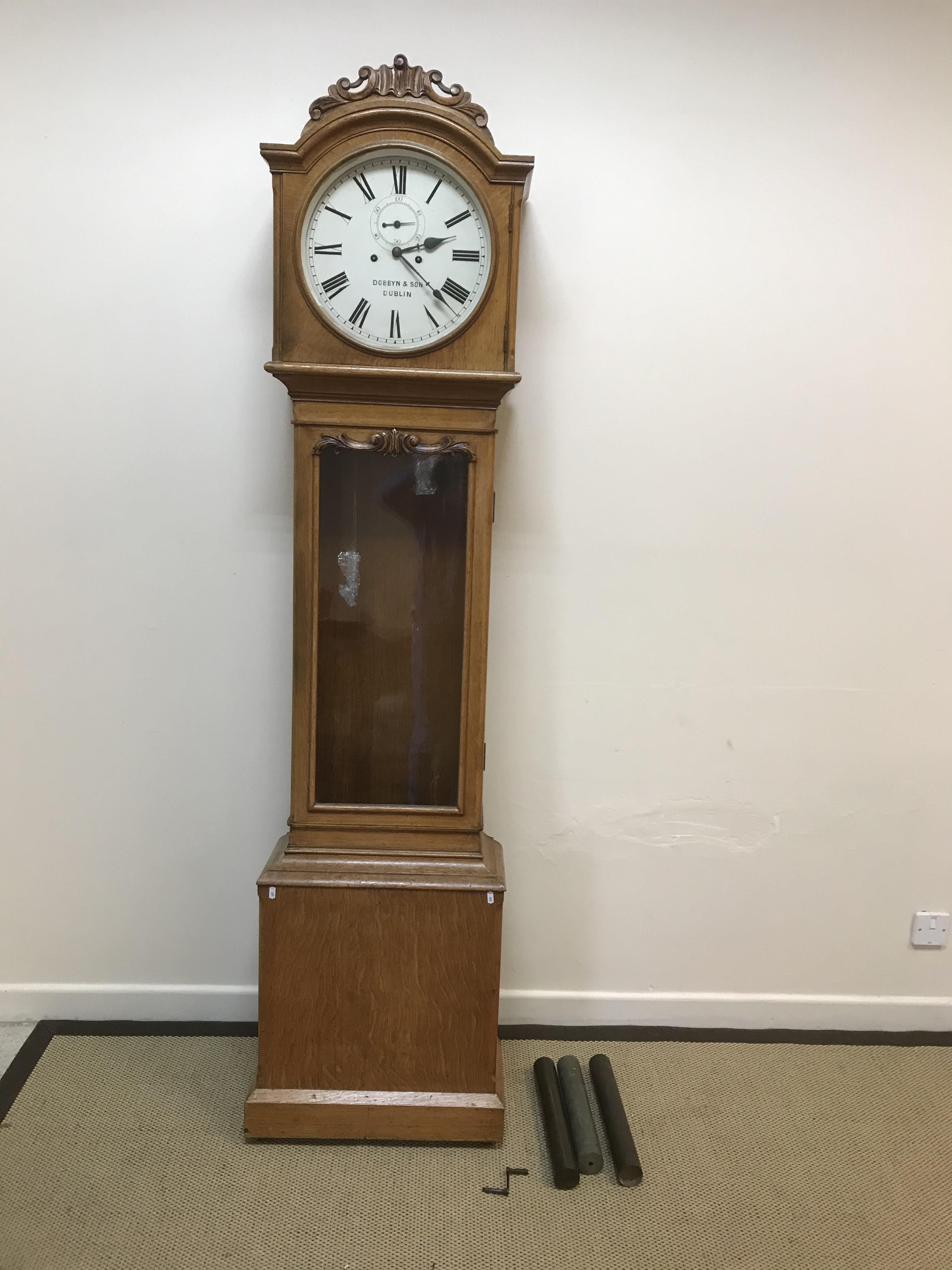 An Irish Victorian oak cased long case clock, the eight day movement with circular enamelled dial