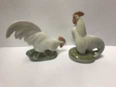 A pair of Royal Copehagen figures of cockerels "Cockerel head up" and "Cockerel head down", 10.5