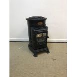 A modern painted metal framed "Provence" gas log burner effect fire of cylindrical form, 46 cm