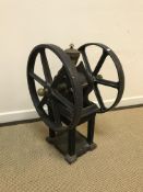 A Victorian cast iron and brass double fly wheel coffee grinder, 70 cm high