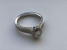 A modern 18 carat white gold diamond and sapphire set "Love" ring by Vera Wang, 0.95 carat weight,