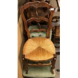 A set of six French oak carved ladder back dining chairs with rush seats, together with a modern oak