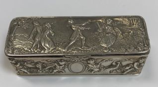 A circa 1900 embossed silver rectangular box with putti musician decoration to the sides and figures