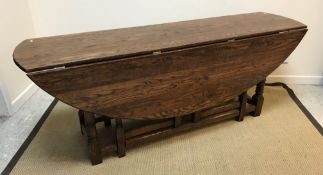 A 20th Century oak wake table in the 17th Century manner, 203 cm x 143 cm x 76 cm high