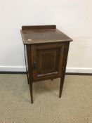 An Edwardian mahogany dressing table, the shield shaped mirrored superstructure with two pairs of