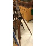A modern brass telescope on adjustable tripod base in the Victorian manner, 102 cm long