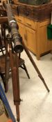 A modern brass telescope on adjustable tripod base in the Victorian manner, 102 cm long