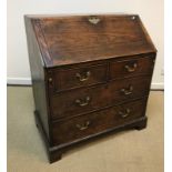 A 19th Century ash bureau, the plain top over a sloping fall enclosing a basic fitted interior, over