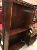 A late Victorian mahogany buffet with shelf on turned and ringed supports over two fielded