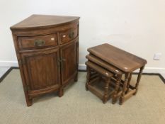 A Chinese cherry wood corner cupboard with two drawers over two cupboard doors, 72 cm wide x 47 cm