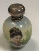 An Edwardian scent bottle, the main porcelain body decorated with Japanese girl folding paper,