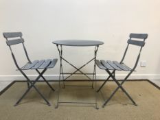 A grey painted metal bistro set comprising circular table and two chairs, table 60 cm diameter x