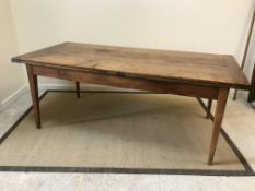 A 19th Century French fruitwood farmhouse kitchen table, the plank top with cleated ends and two