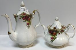 A Royal Albert "Country Roses" tea / coffee service comprising twelve teacups and saucers, four