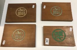 Four wood bound Chinese books "Picture Story of Preparing Tea" with woodblock on fabric