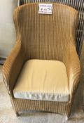 A Marks and Spencer cane work wing back conservatory chair with cushion