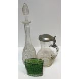 A collection of glassware to include four cut glass decanters, a pair of baluster shaped jugs with