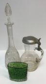 A collection of glassware to include four cut glass decanters, a pair of baluster shaped jugs with