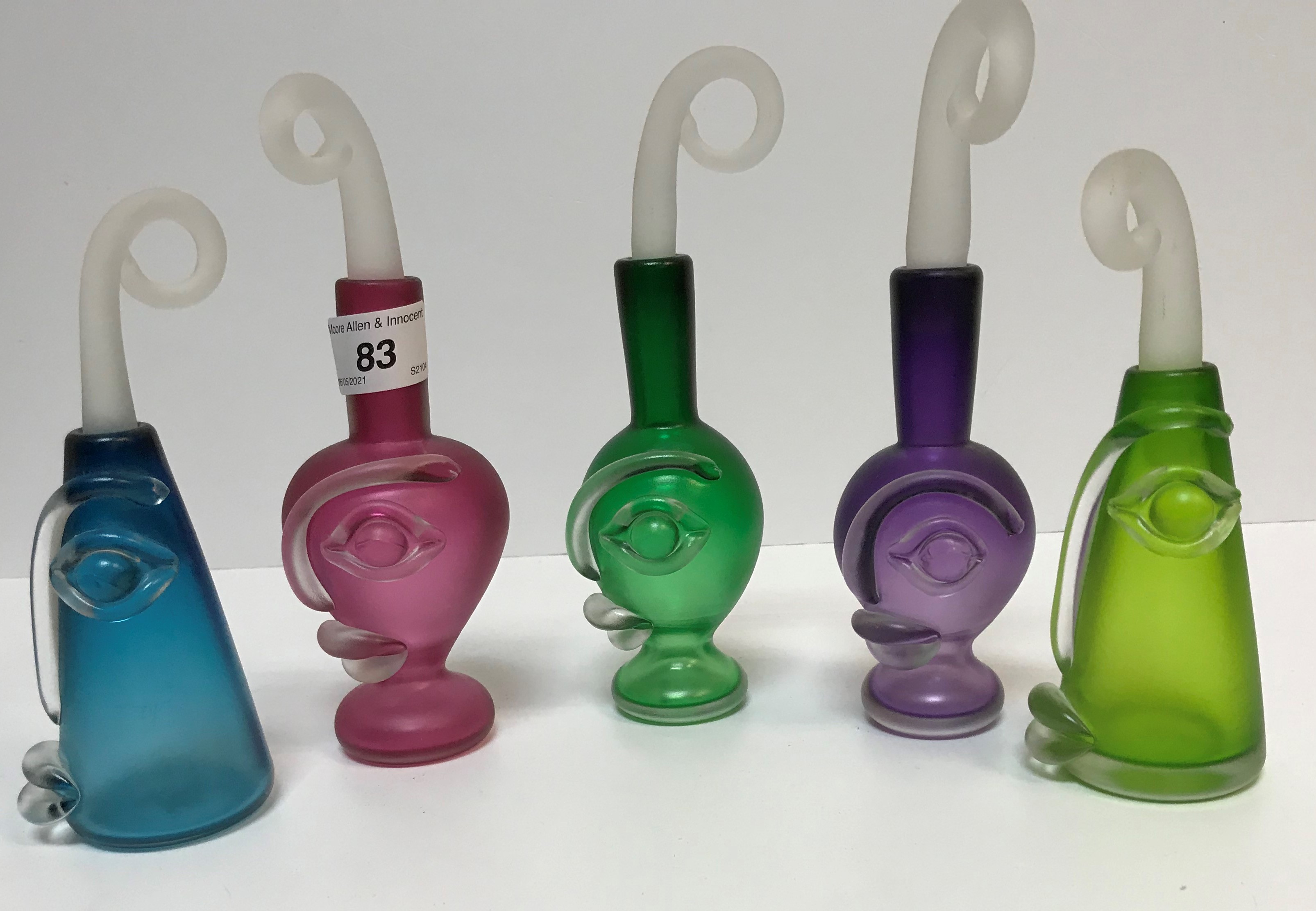A collection of five Leystyn Davis Blowzone "Visage" dressing table scent bottles and stoppers in