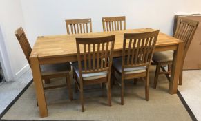 An Arthur Llewellyn Jenkins oak dining room suite comprising rectangular table, 175 cm long x 90