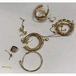 A collection of 9 carat gold and yellow metal jewellery to include earrings, chain, gold teeth caps,