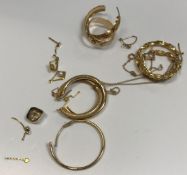 A collection of 9 carat gold and yellow metal jewellery to include earrings, chain, gold teeth caps,