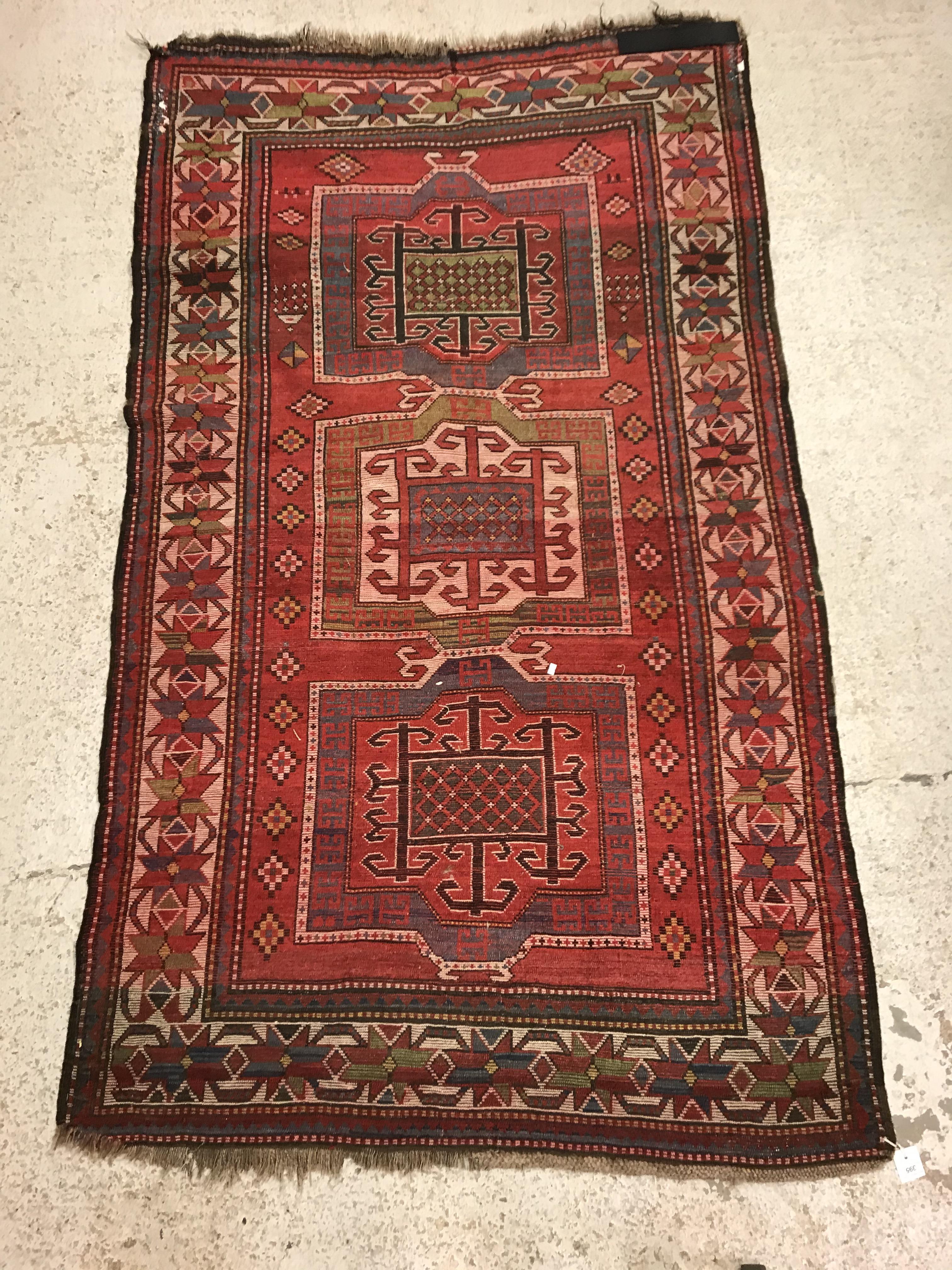 A Kasak runner, the central panel set with three repeating square medallions on a red ground - Image 10 of 10
