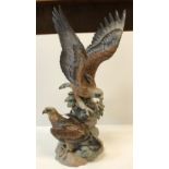 A Lladro polychrome decorated sculptural group of "Two Eagles", stamped to the bottom and signed "