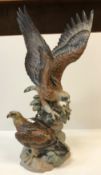 A Lladro polychrome decorated sculptural group of "Two Eagles", stamped to the bottom and signed "