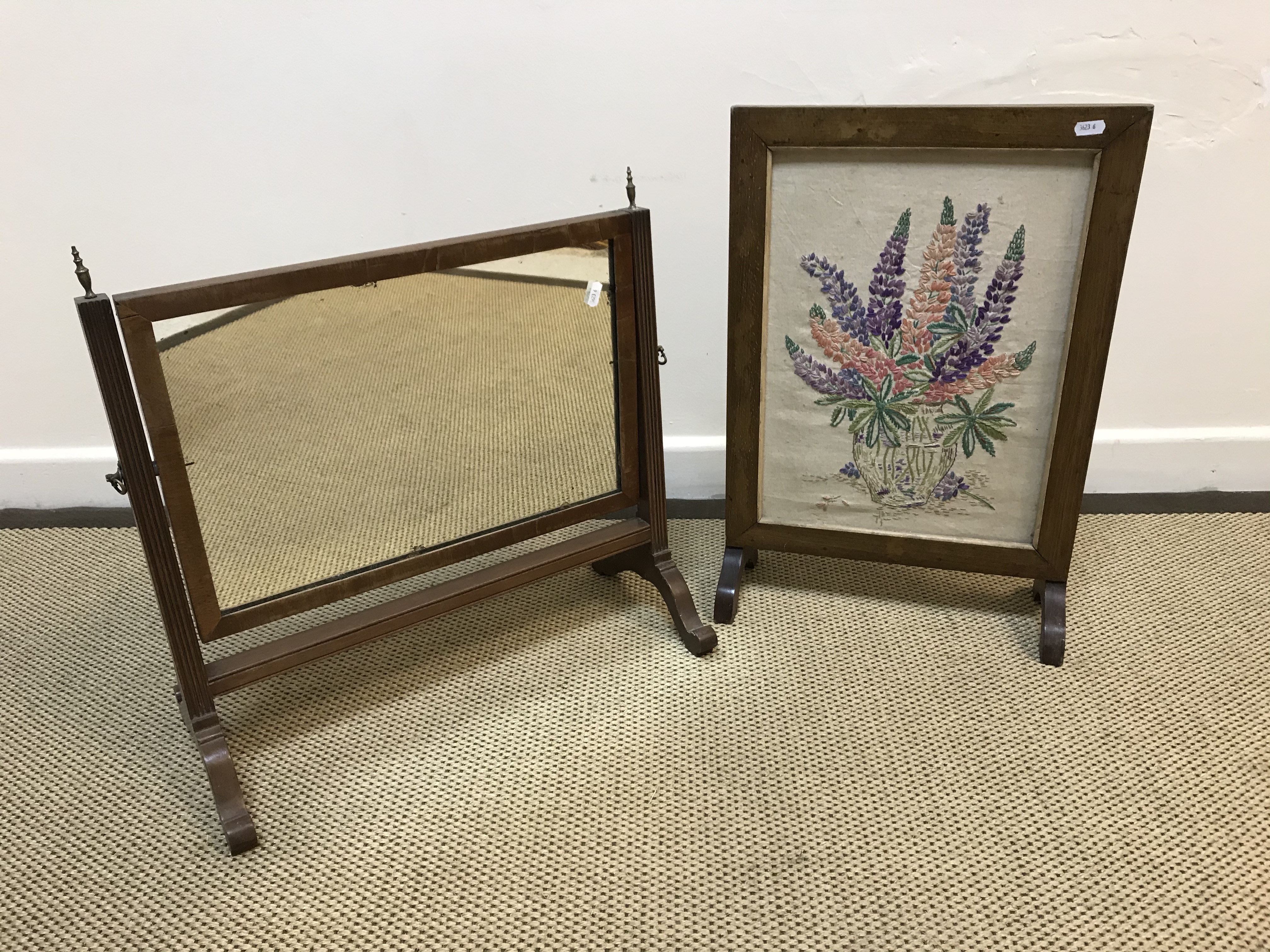 A Victorian oak revolving bookcase with side reading slope over slatted sides on a cruciform base to